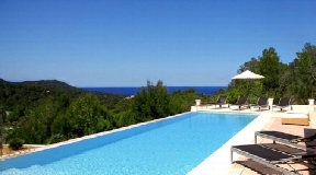 Modern villa in Cala Tarida with panoramic sea views